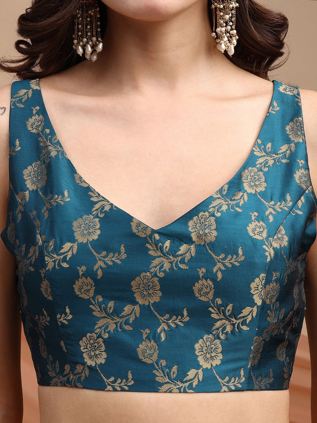 Teal colour brocade sleeveless blouse